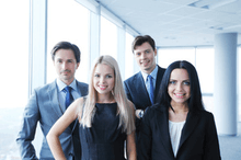 four coworkers in an office 