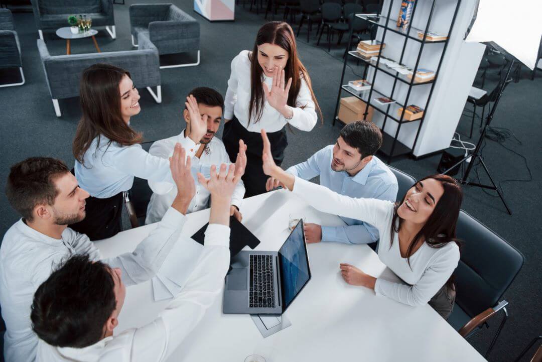Coworkers celebrating their results in ther 360 degree performance appraisal